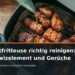 Heißluftfritteuse richtig reinigen: Korb, Heizelement und Gerüche – geöffnete Heißluftfritteuse mit Gargut